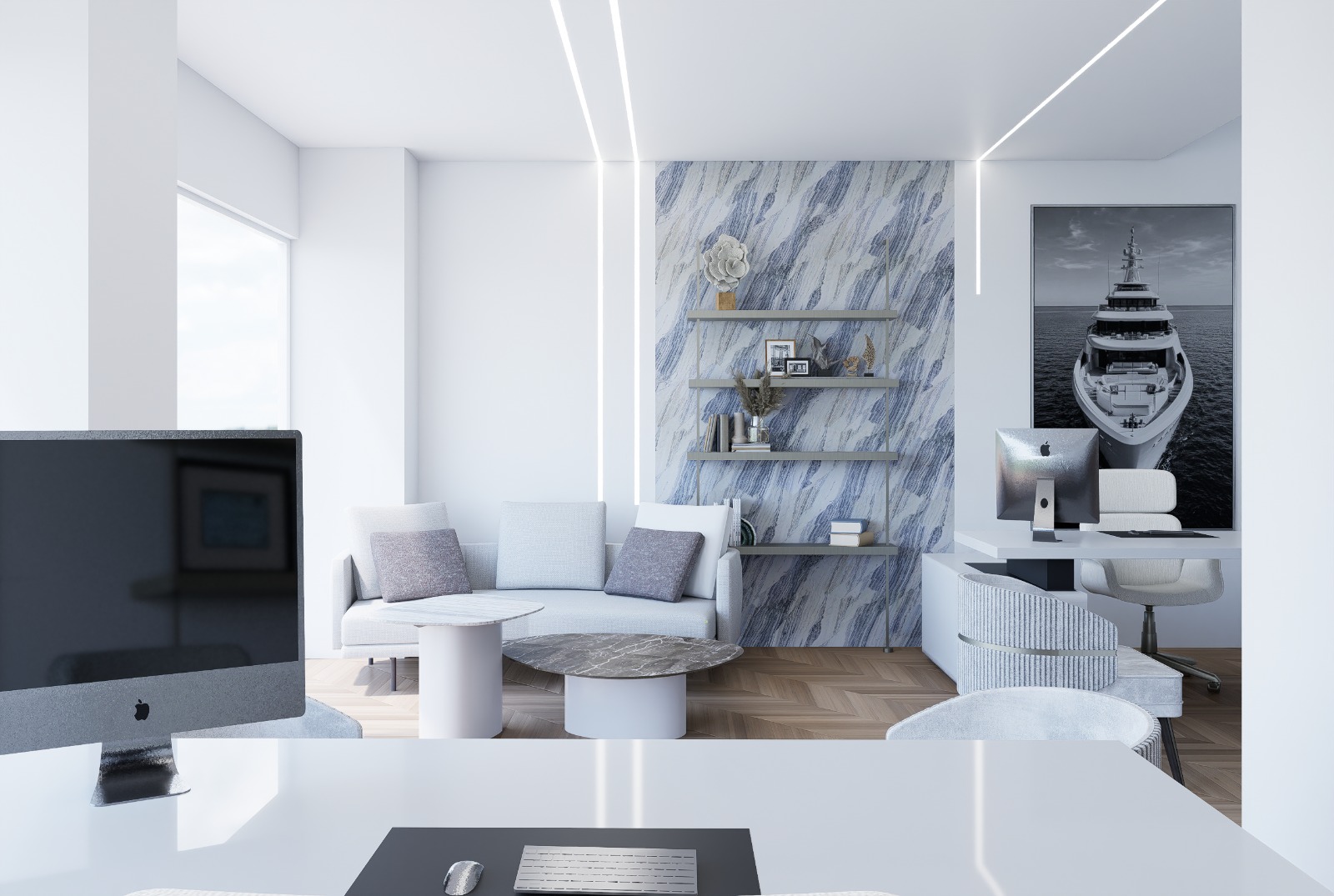 Modern student lounge with sofa, workstations and yacht artwork