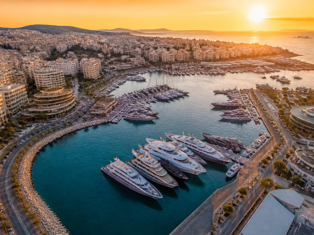 Aerial view of Zea Marina in Athens at sunset with luxury superyachts